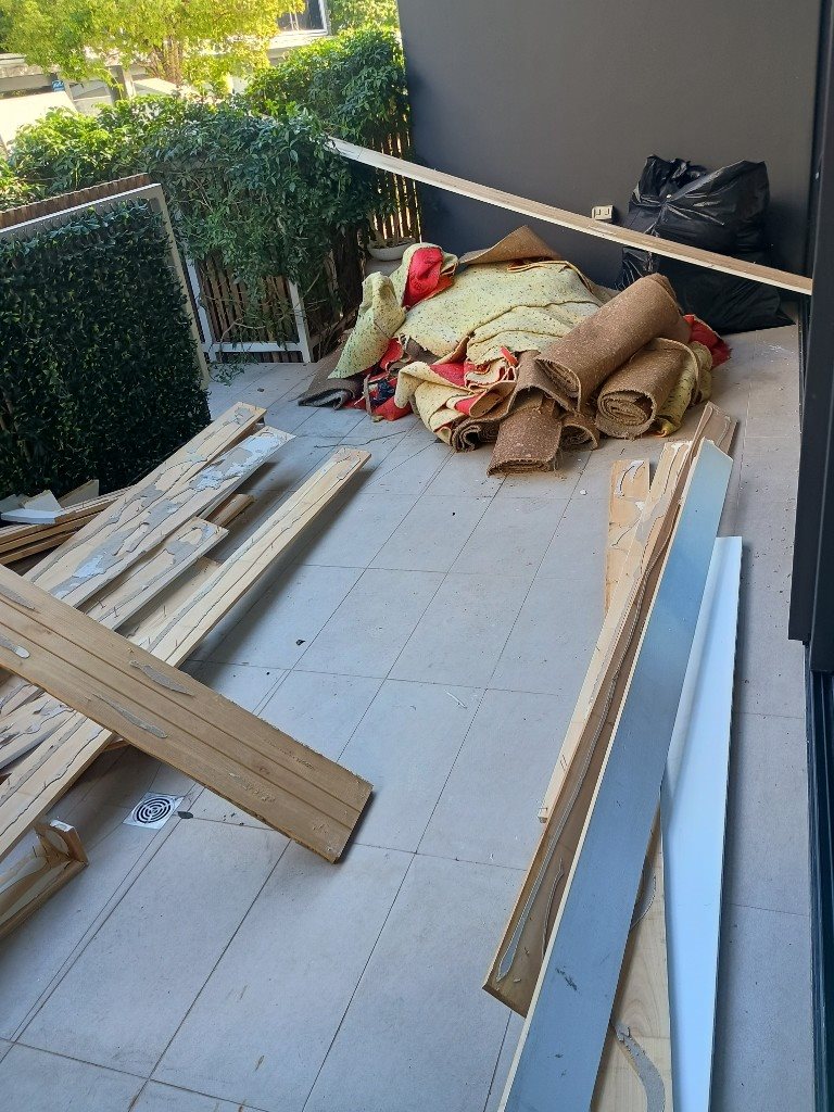 Household rubbish piled before removal in Aura